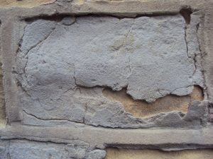 old stone with cement render